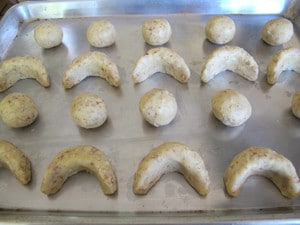Cookie dough rolled into balls and crescents.