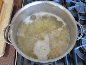 Pasta cooking in a stockpot.