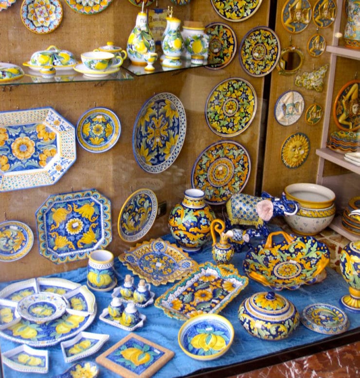 Colorful maoilica pottery in a shop window - Taormina, Italy.