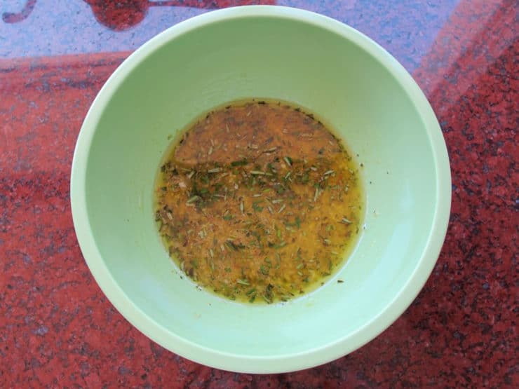 Lemon olive oil marinade in a bowl.