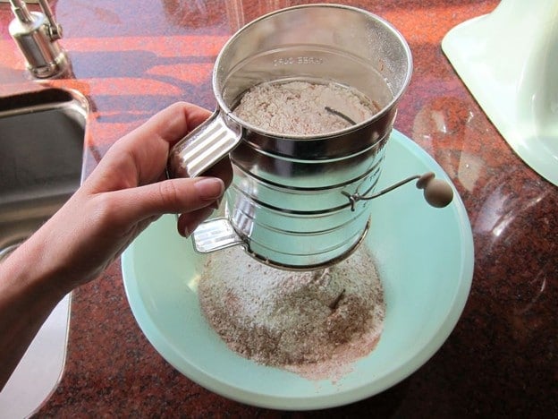 Sift flour into a mixing bowl.