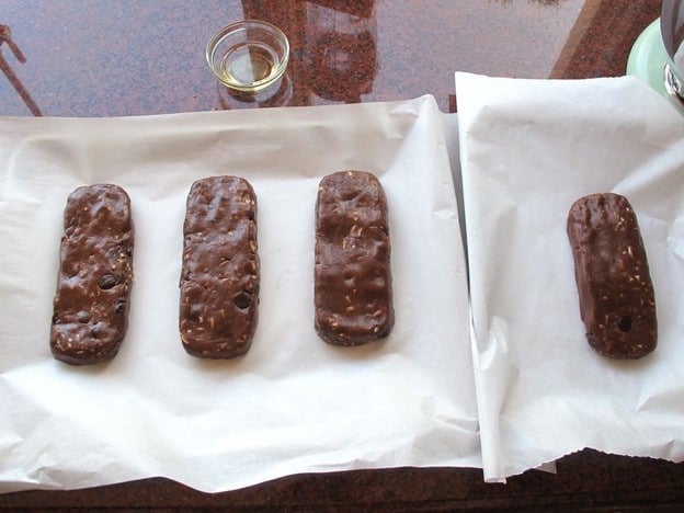 Cookie dough shaped into short logs.