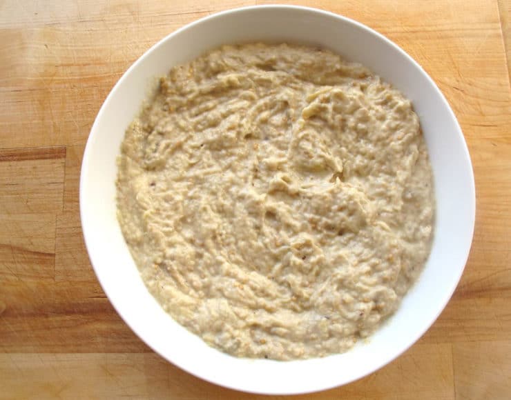 Classic Baba Ghanoush - Recipe for smoky Middle Eastern roasted eggplant dip with tahini, garlic, lemon, olive oil and spices.