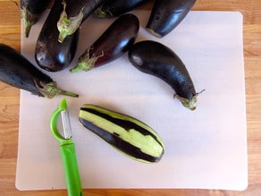 Peeling eggplant.
