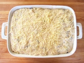 Casserole topped with shredded cheese.