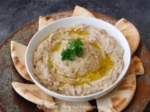 Classic Baba Ghanoush - Recipe for smoky Middle Eastern roasted eggplant dip with tahini, garlic, lemon, olive oil and spices.