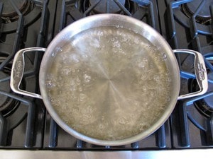 Sugar in boiling water in a saucepan.