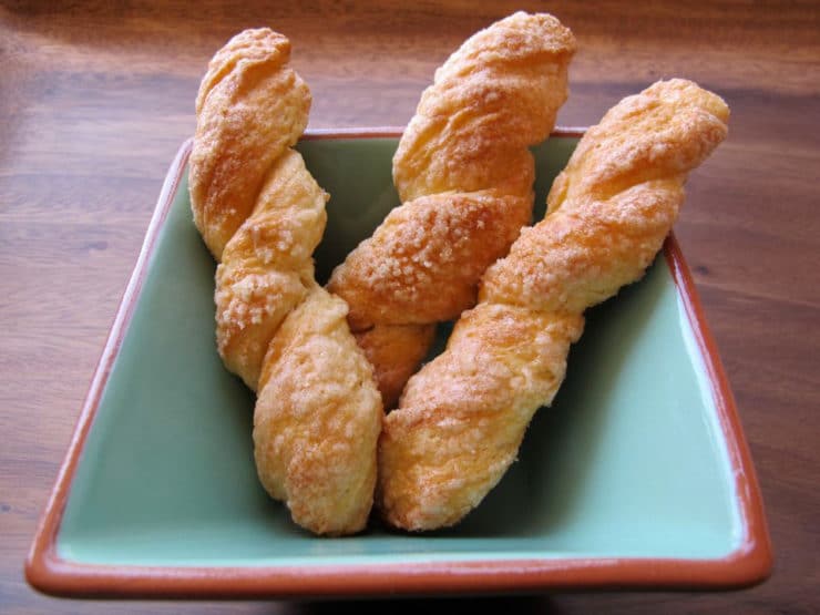 Renée\'s Sour Cream Twists - A Jewish family recipe for delectable German cookies dipped in sugar and baked to tender-crisp perfection. Kosher, Dairy.