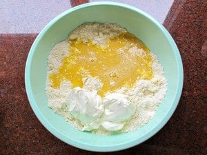 Stirring eggs into flour mixture.