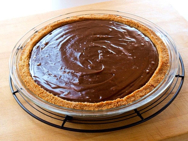 Chocolate Icebox Pie - Learn to make Chocolate Icebox Pie topped with whipped cream and nuts from the vintage 1950's cookbook, Recipes from Old Virginia.