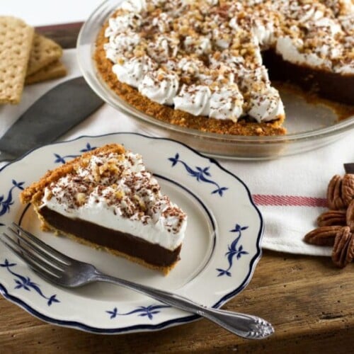 Chocolate Icebox Pie - Learn to make Chocolate Icebox Pie topped with whipped cream and nuts from the vintage 1950's cookbook, Recipes from Old Virginia.