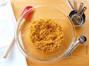 Graham cracker crumbs in a mixing bowl.