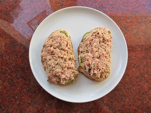 Tuna salad on sliced bread.