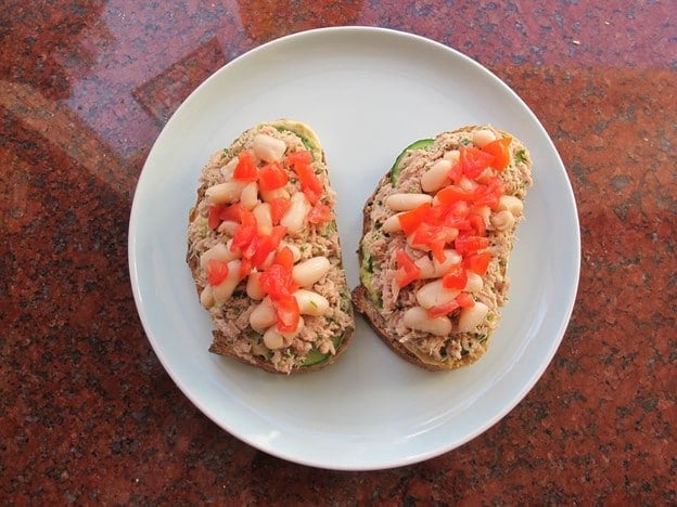 Diced tomato on top of tuna salad.