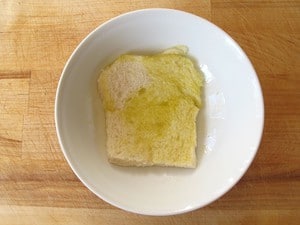 Slice of bread soaking up olive oil.