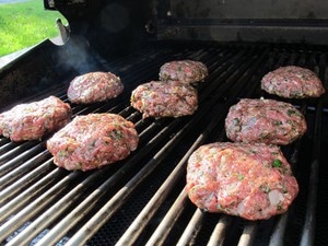 Burger patties on the grill.