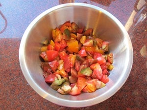 Diced heirloom tomatoes in a mixing bowl.