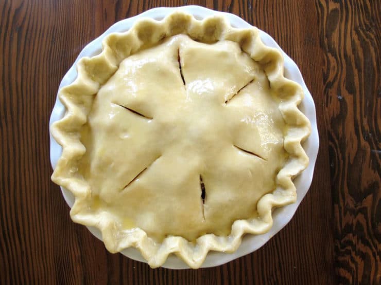 Slits cut into top pie crust.