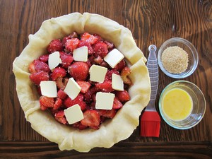 Strawberry pie filling dotted with butter.