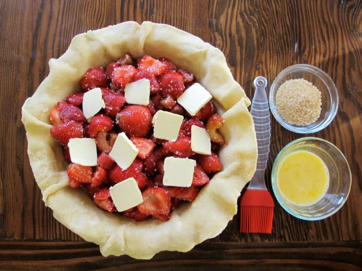 Strawberry pie filling dotted with butter.