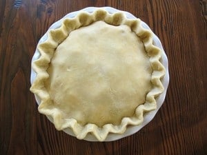 Top crust placed on pie and edges crimped.