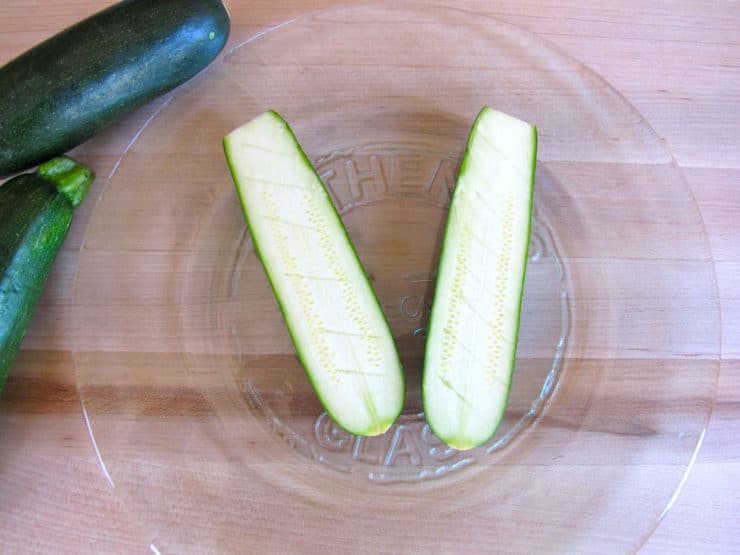 Score zucchini flesh with a knife.