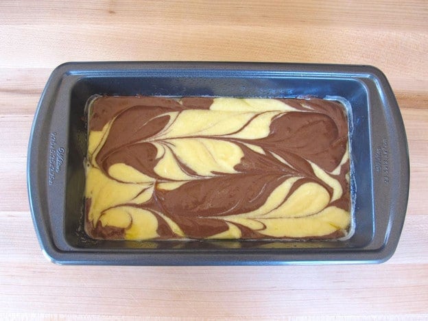 Small rectangular cake pan with two marbled batters.