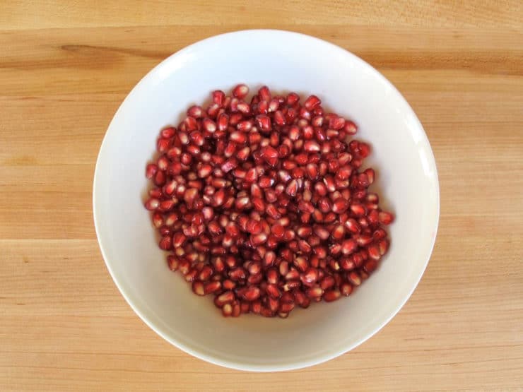 Pomegranate seeds in a bowl.