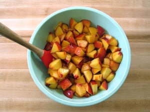 Diced peaches in a large mixing bowl.