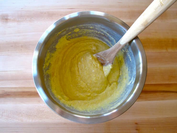Wet ingredients stirred into cornmeal.