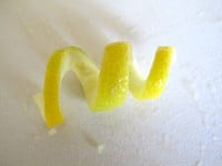 Twist lemon peel into a curl.