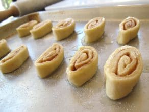 Pie crust pinwheels, unbaked on baking sheet glazed with melted butter.