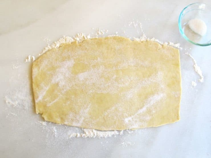 ie crust pinwheel dough on marble surface.