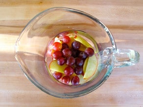 Grapes added to a sangria pticher.
