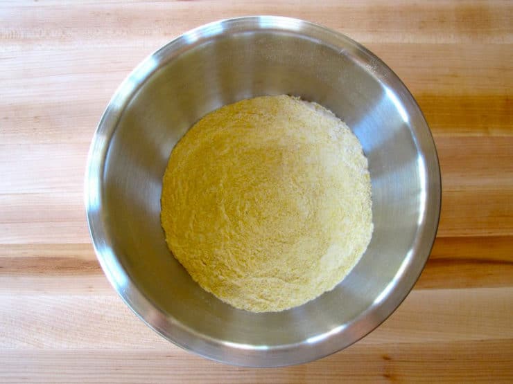 Cornmeal and flour mixed in a bowl.