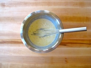Whisk eggs and butter in a small bowl.