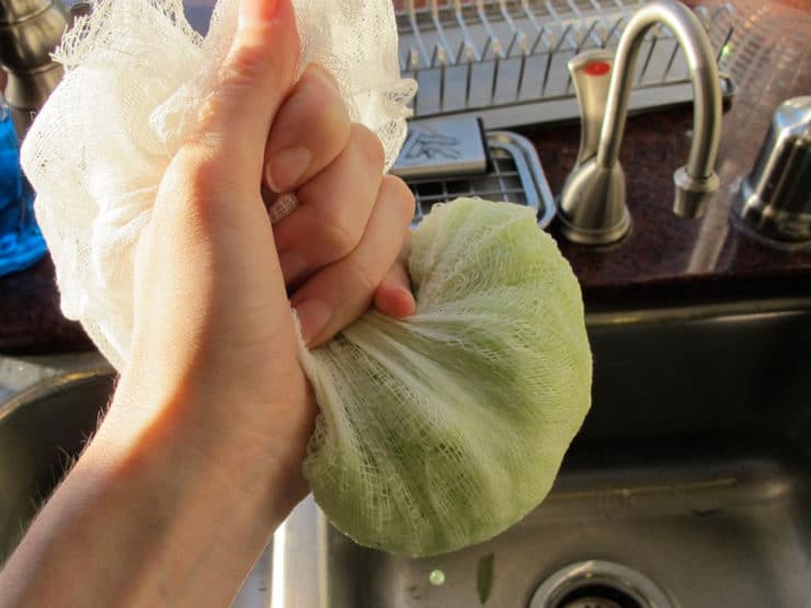 Squeeze moisture out of zucchini in a cheesecloth.