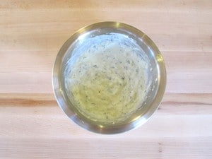 Drained cucumber mixed into Greek yogurt.