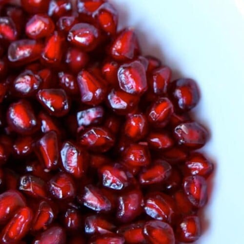 Close up - plate of pomegranate seeds - arils.