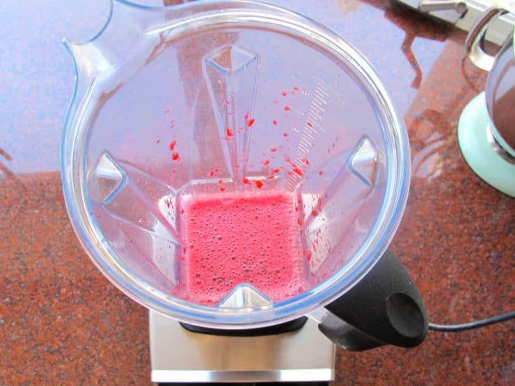 Pomegranate seeds pulsed in a blender.