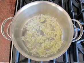 Diced onion in a saucepan.