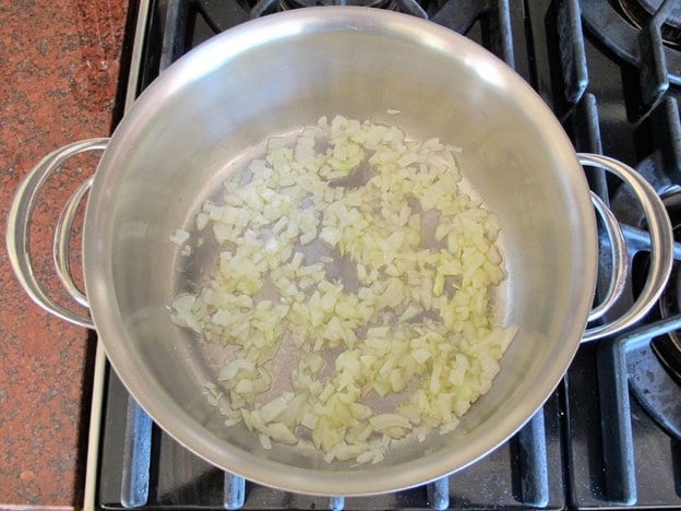 Diced onion in a saucepan.