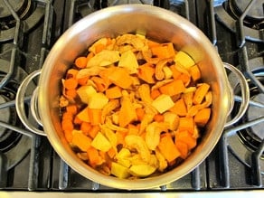 Add chicken broth to vegetables in stockpot.