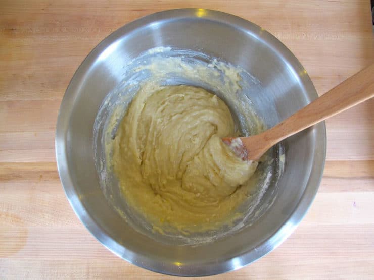 Gently mix flour into wet ingredients in a bowl.