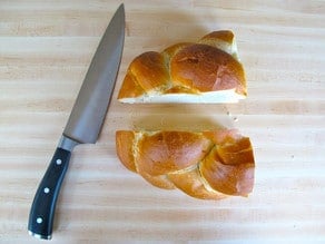 Challah loaf sliced in half.
