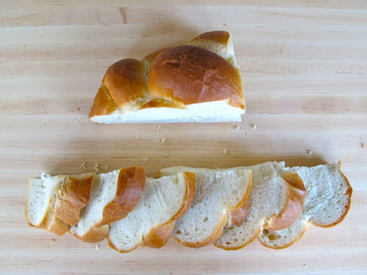 Cutting slices of challah.