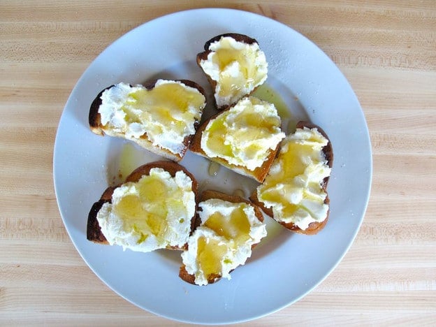 Honey drizzled over ricotta challah.