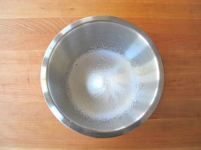 Powdered sugar sifted into a mixing bowl.