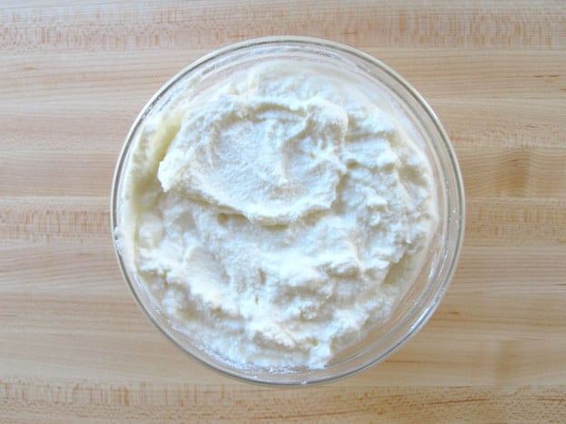 Lemon juice stirred into ricotta cheese.