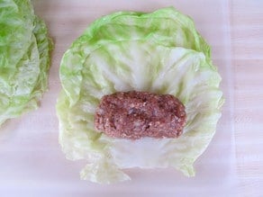 Setting ground meat in a cabbage leaf.